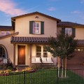 william-lyon-homes-quick-delivery-home-at-twin-oaks-in-whitney-ranch-rocklin-california-picture-of-two-story-home-with-covered-porch-and-brown-tile-roof